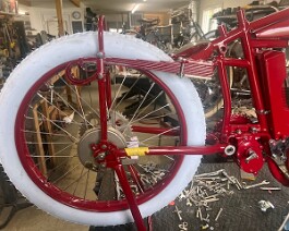 Right side view of rear wheel with new Coker "button" tire and hub in place.